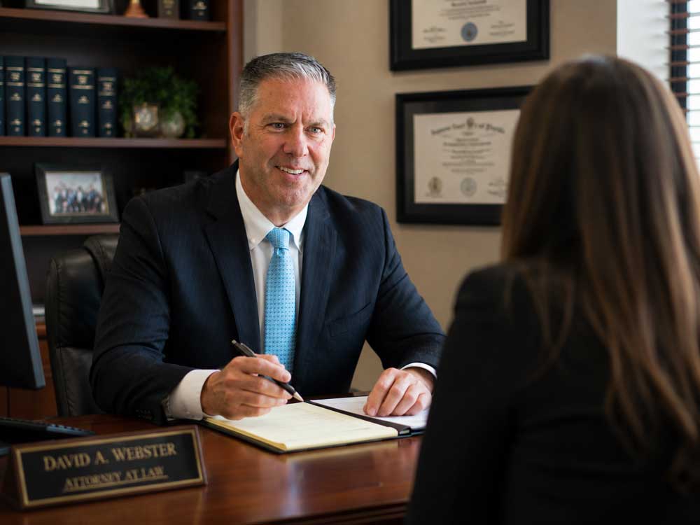 David A Webster, A criminal defense attorney in Longwood, FL discussing a defense case with a client in Central Florida.
